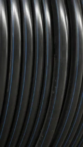 Black PE irrigation hose with blue identification stripes